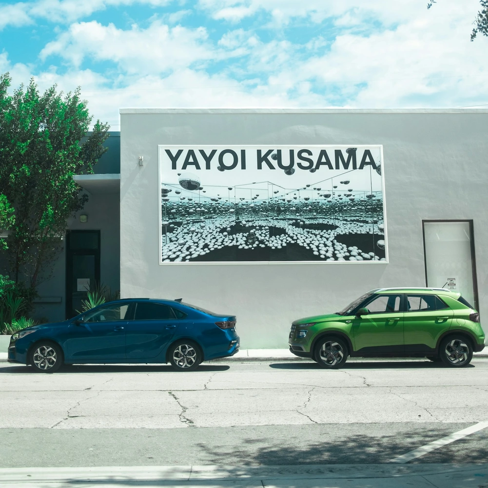 Storefront on a Miami street with cars parked outside